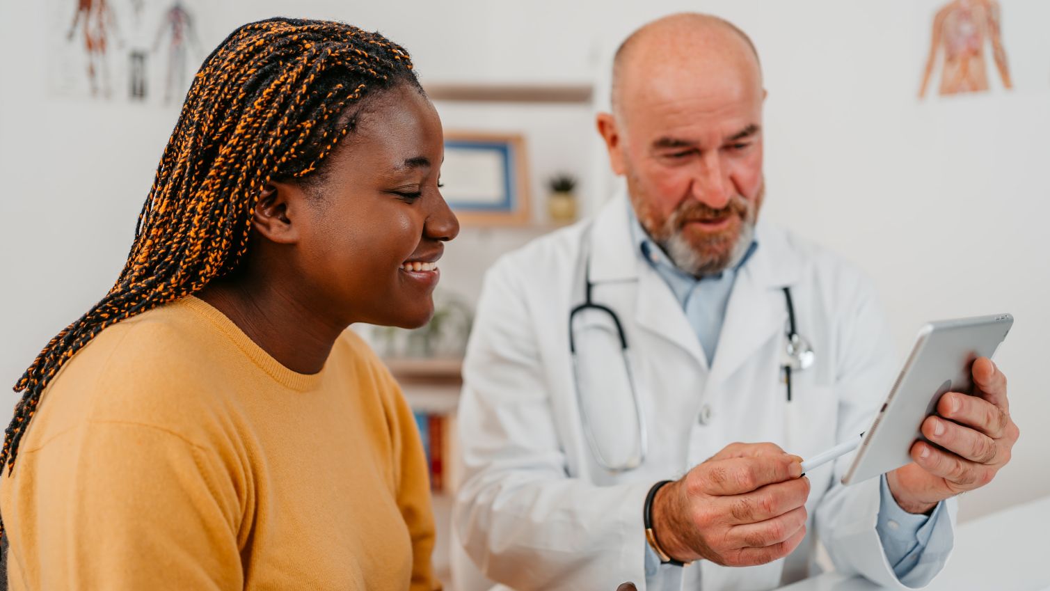 Doctor going over notes with female patient.