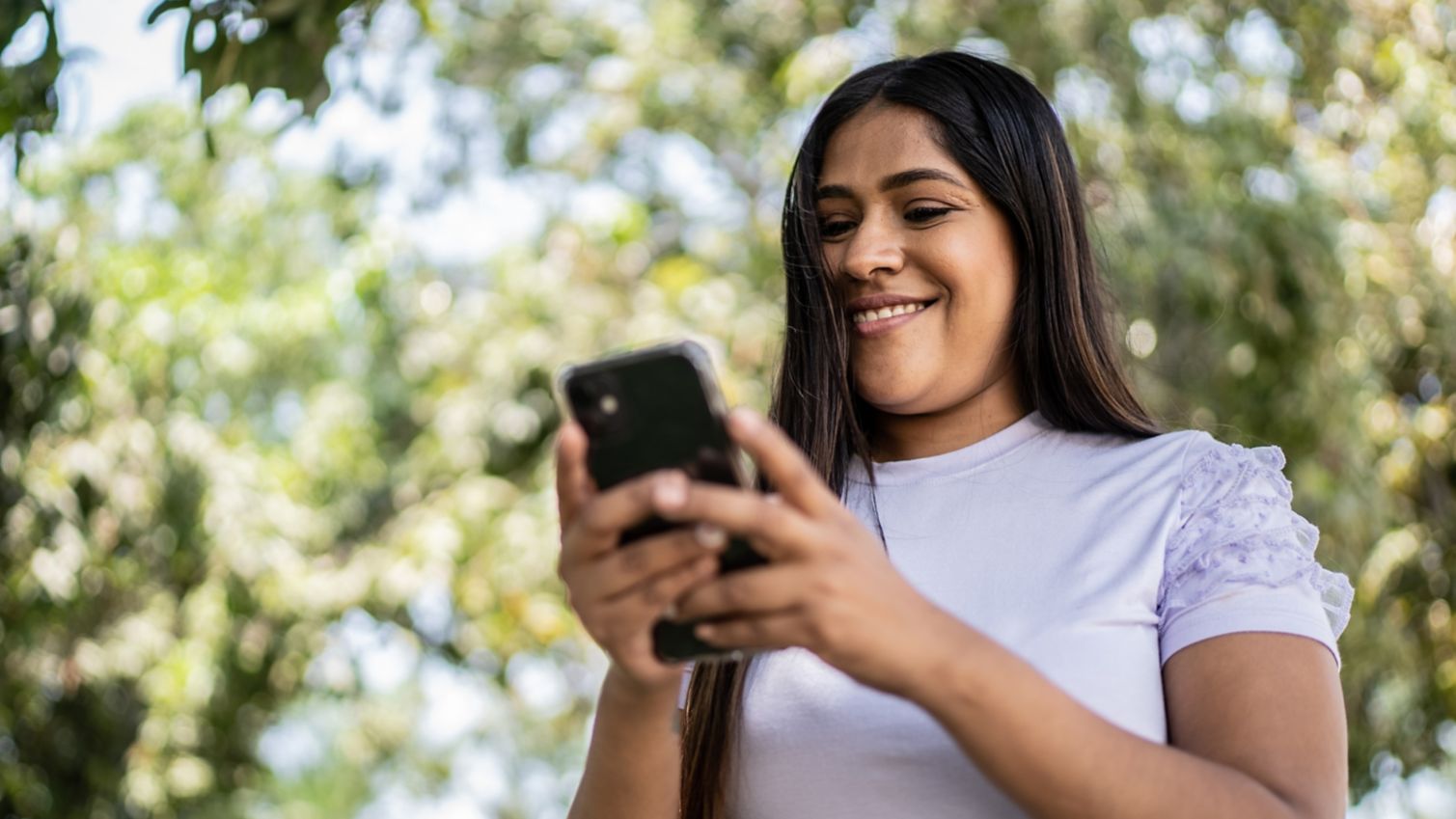 Woman looking up resources on cellphone