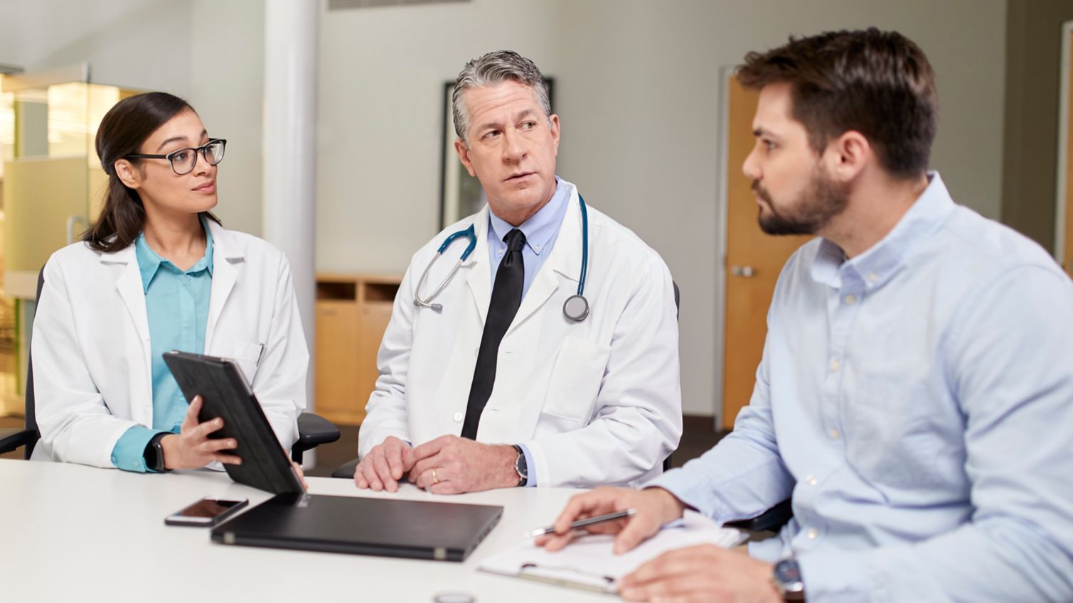 Three physicians discuss patient care
