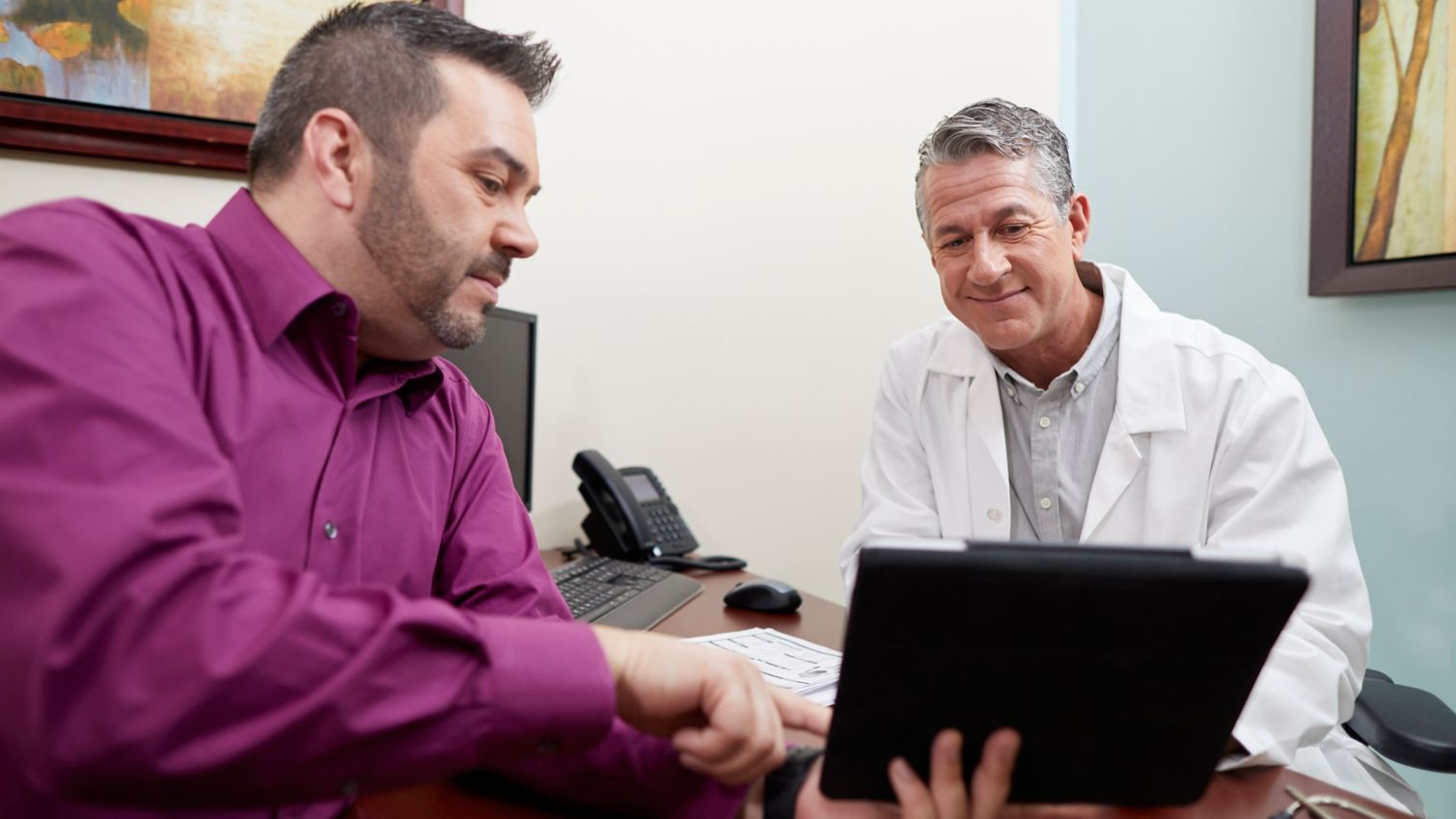 Two doctors discussing a patient's chart