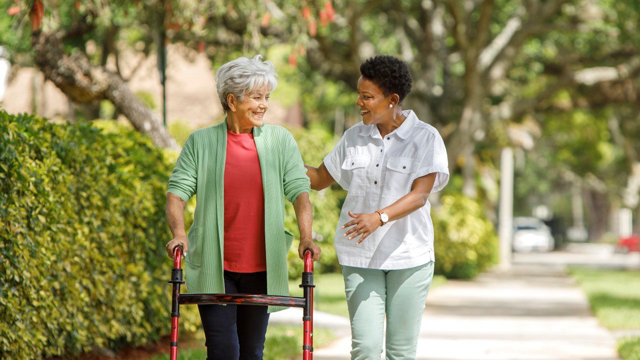 Younger woman and older woman smiling