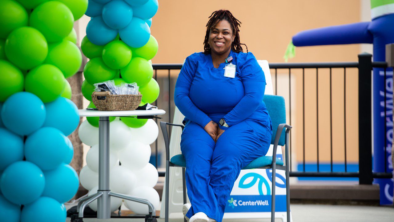 Woman sitting in front of new CenterWell Senior Primary Care center