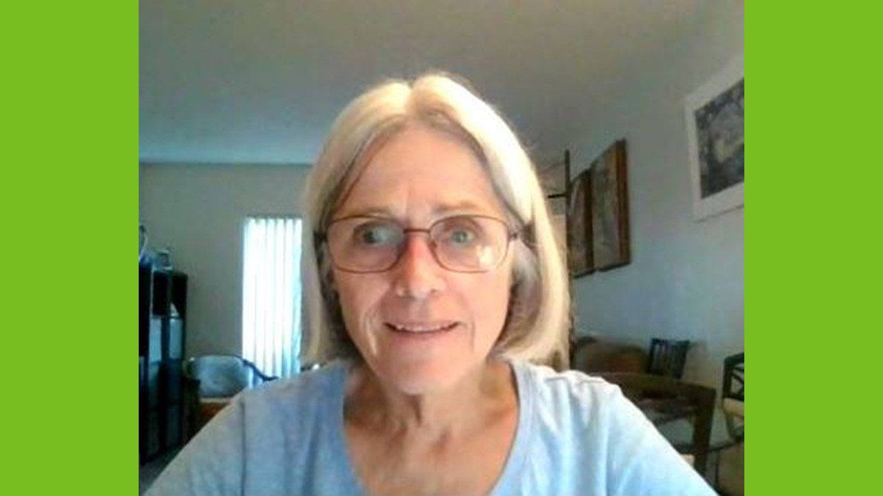 Woman with blond hair speaking