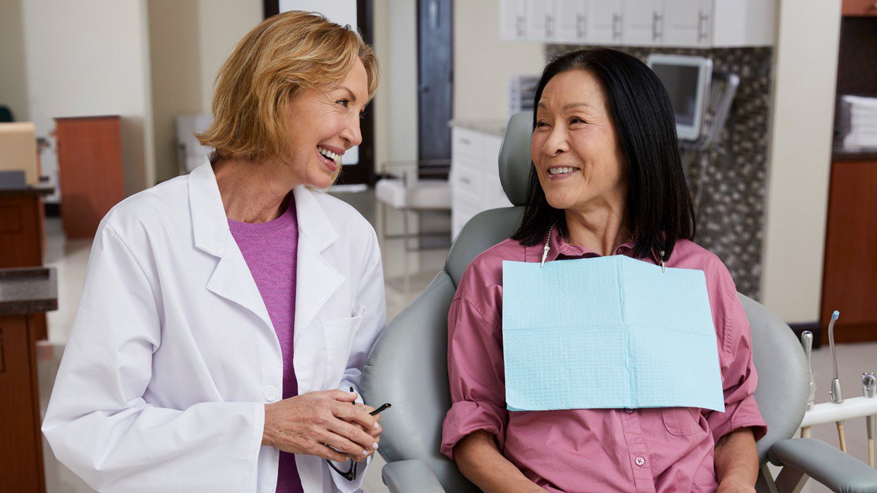 Female patient and dentist talking