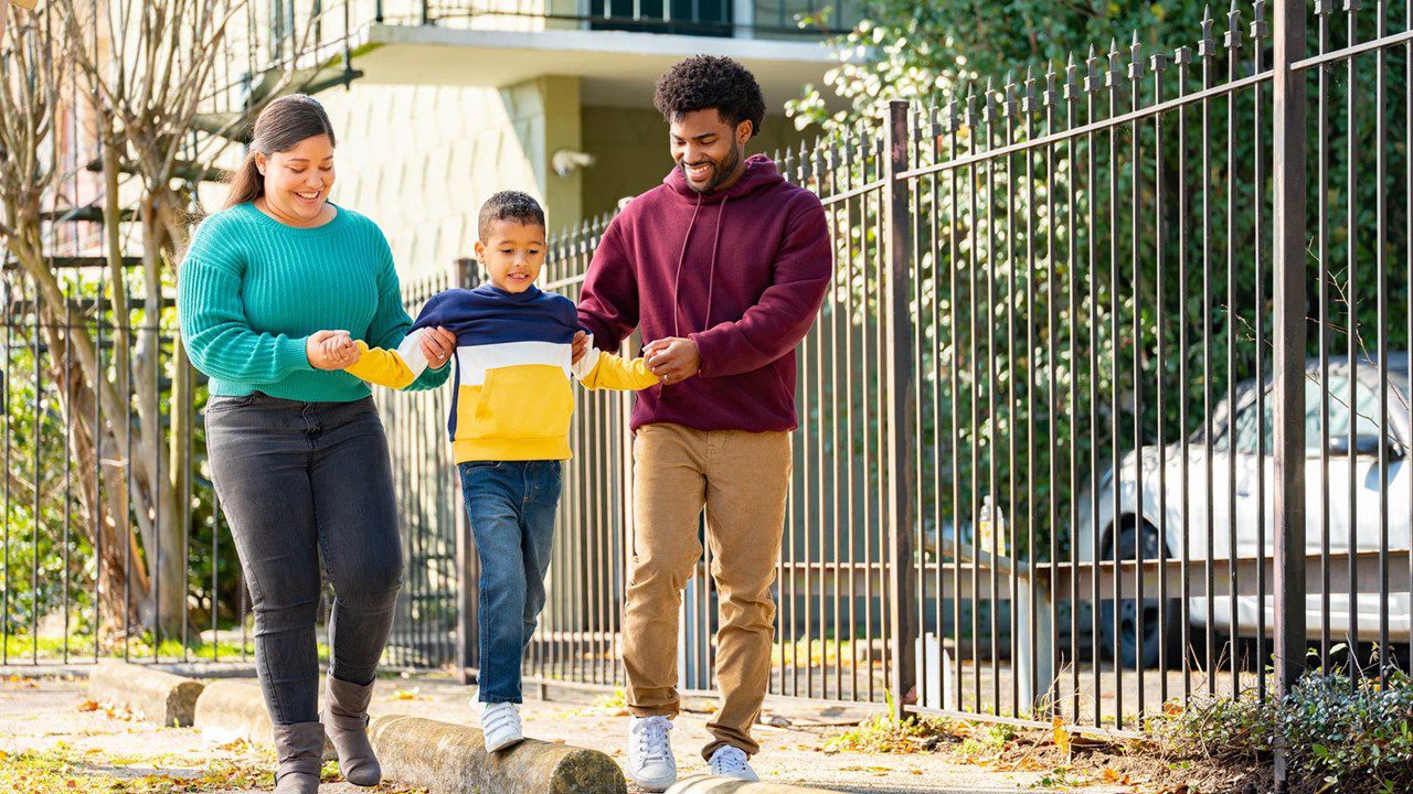 Family of three walking