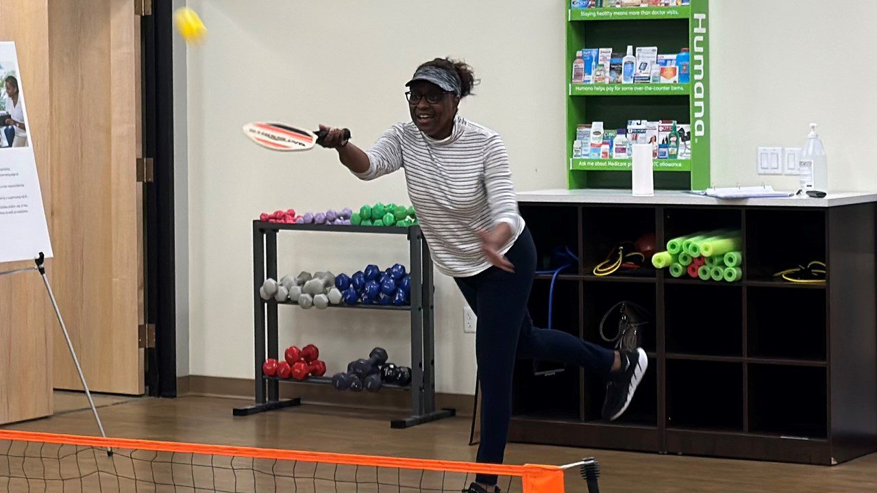 Woman playing pickleball at Humana Neighborhood Center