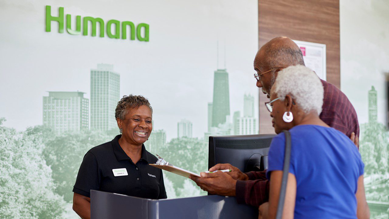 Humana Neighborhood Center members talking to associate