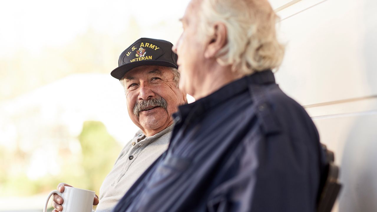 Veterans sharing coffee outside