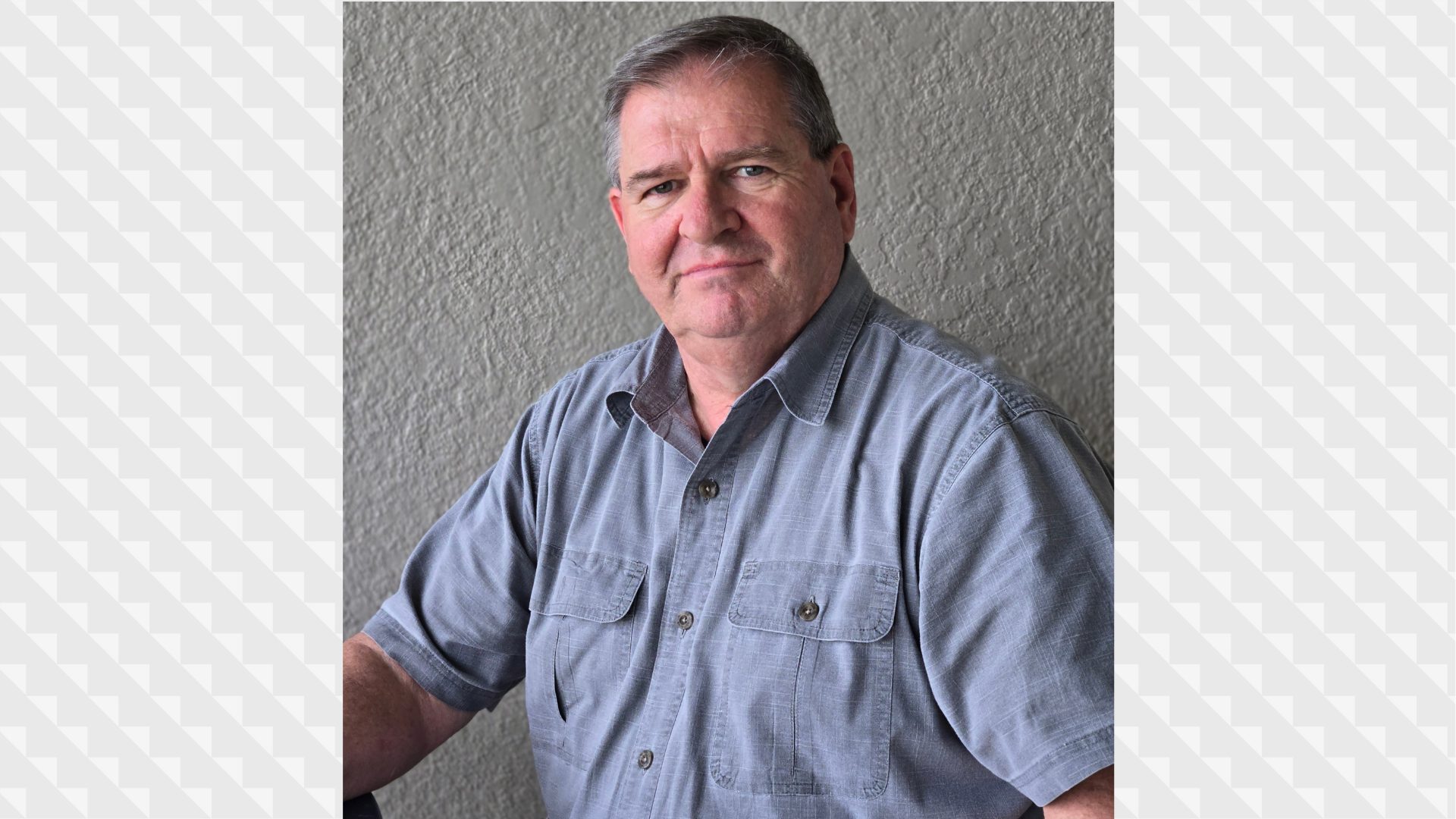 Older gentleman wearing a blue shirt
