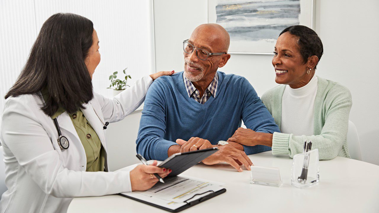African American couple consulting with their doctor