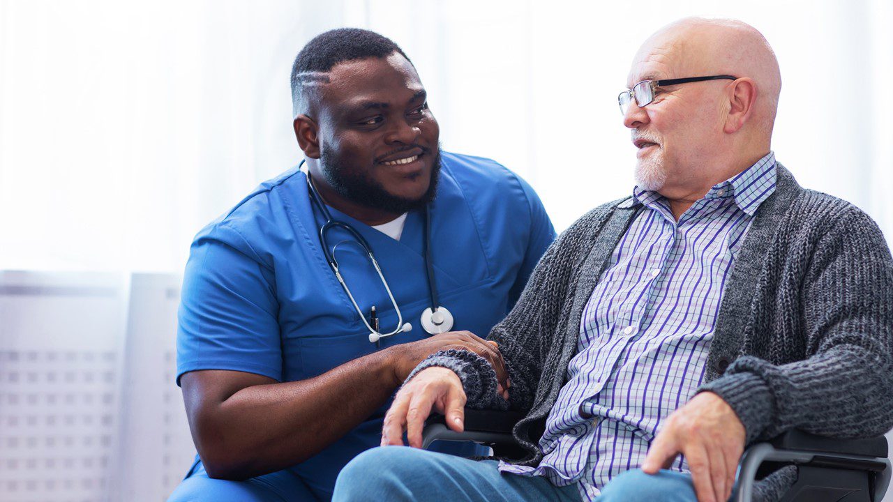 Men in chair with male nurse