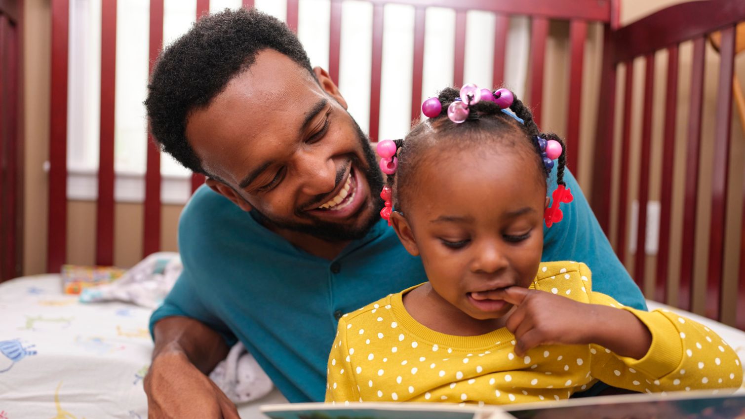 Dad reads to Medicaid member