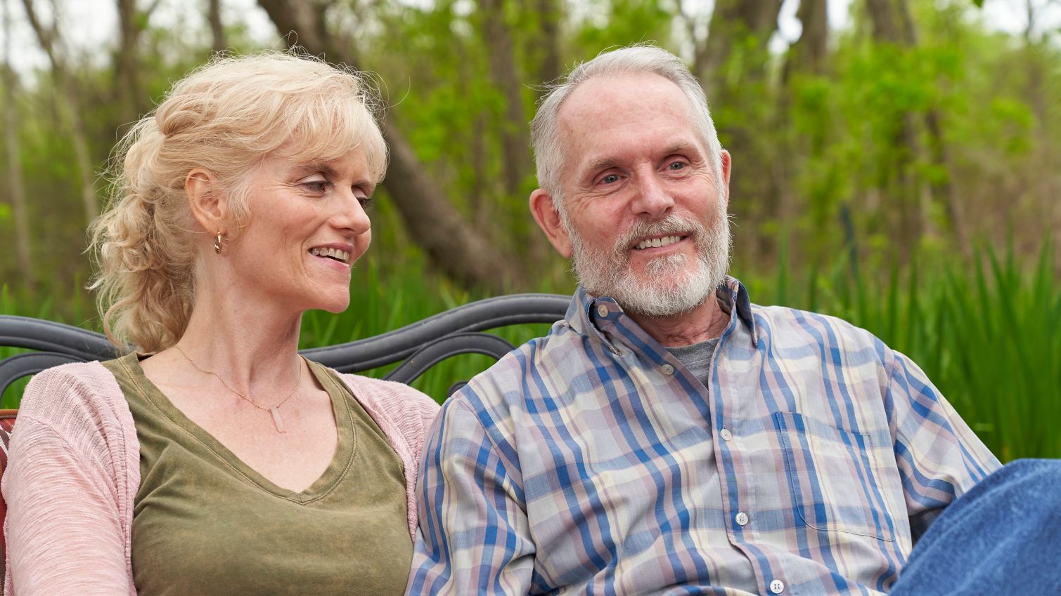 Older couple site outside talking