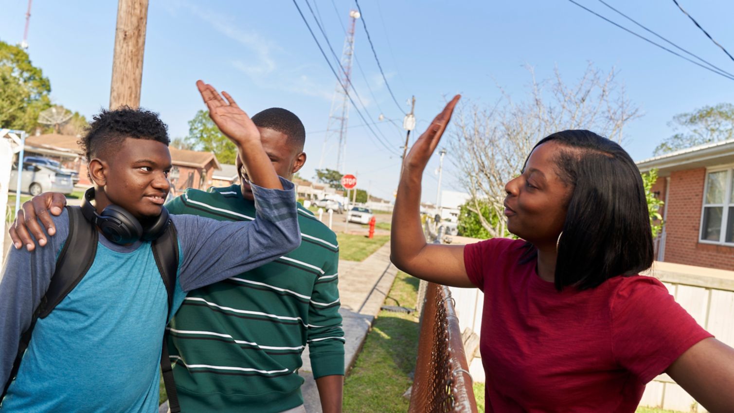 Woman gives teenager a highfive