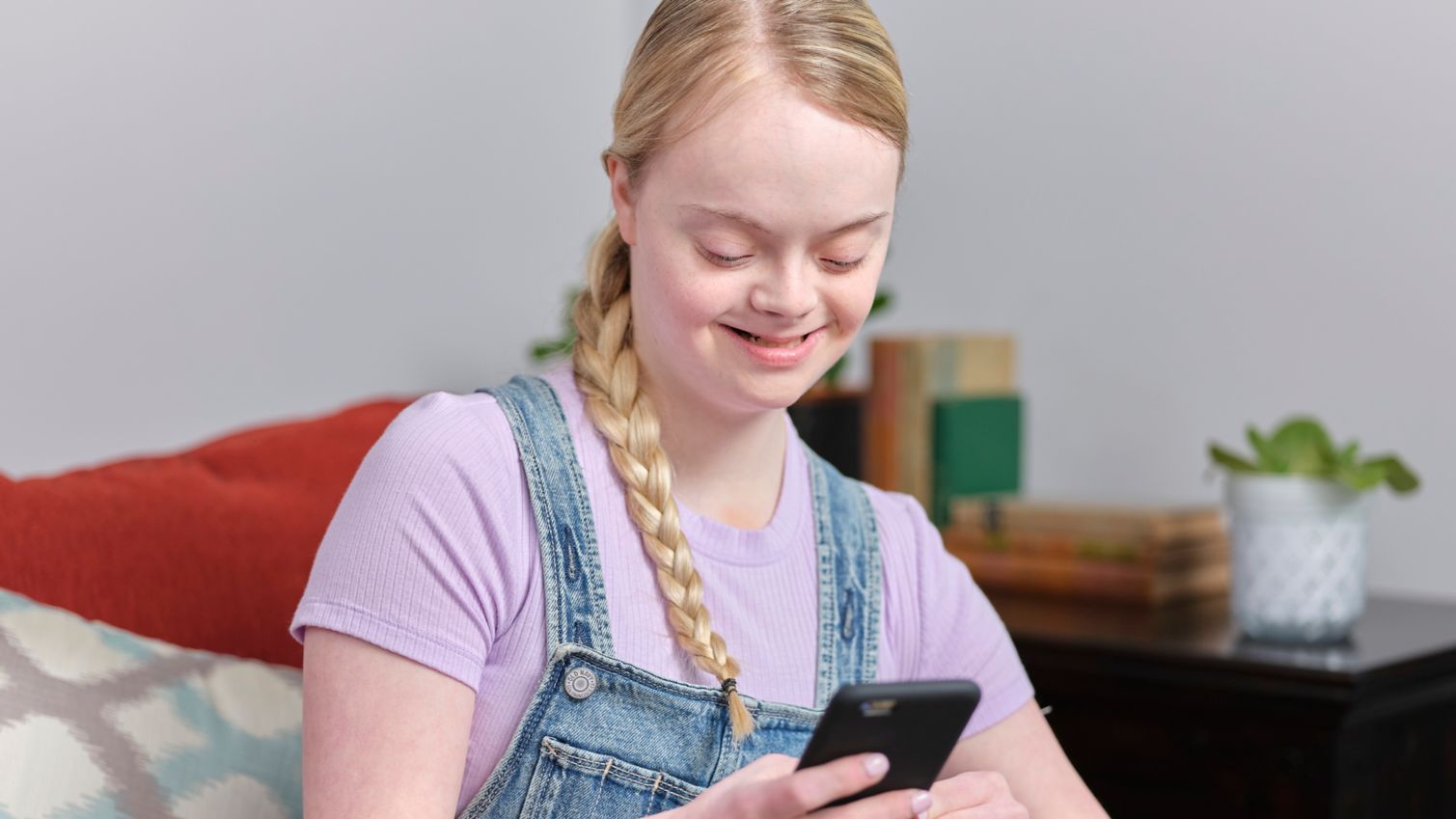 Medicaid member uses her cellphone