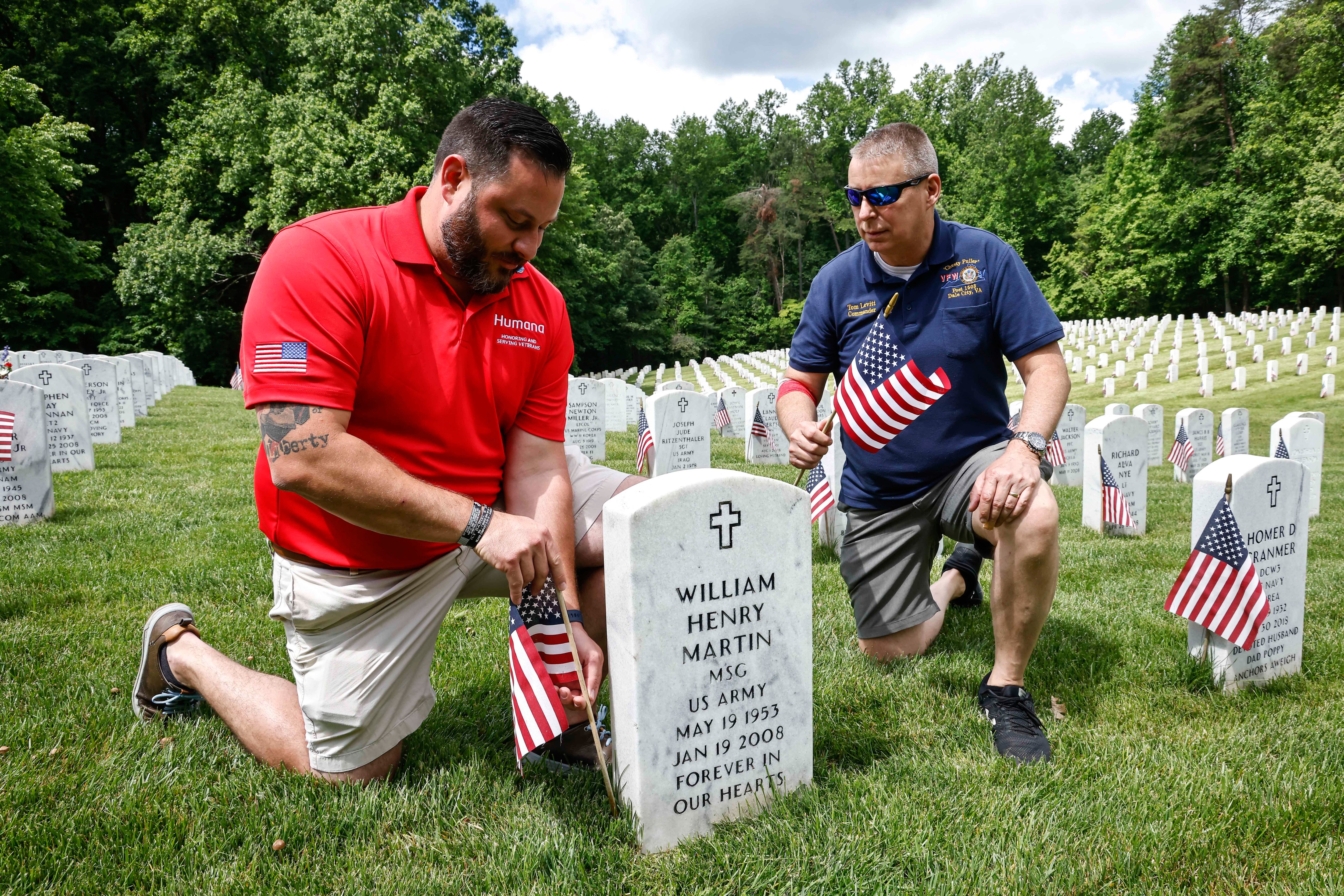 Humana associates place flags at Quantico National Cemetery honoring the many Veterans who have fallen and given the ultimate sacrifice for our nation on Saturday, May 28, 2022 in Quantico, VA. (Paul Morigi/AP Images for Humana, Inc.)